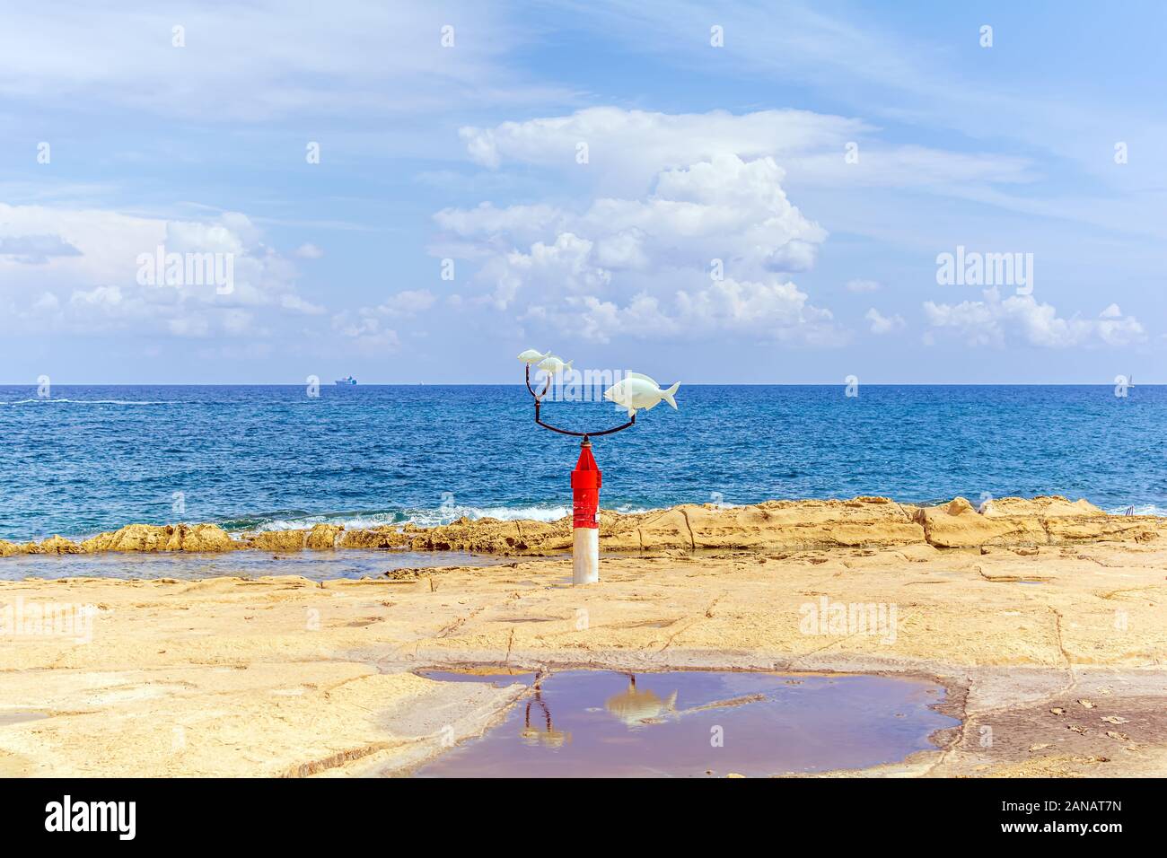 White and red weather vane with saddled breams at Exiles Beach, Sliema Stock Photo