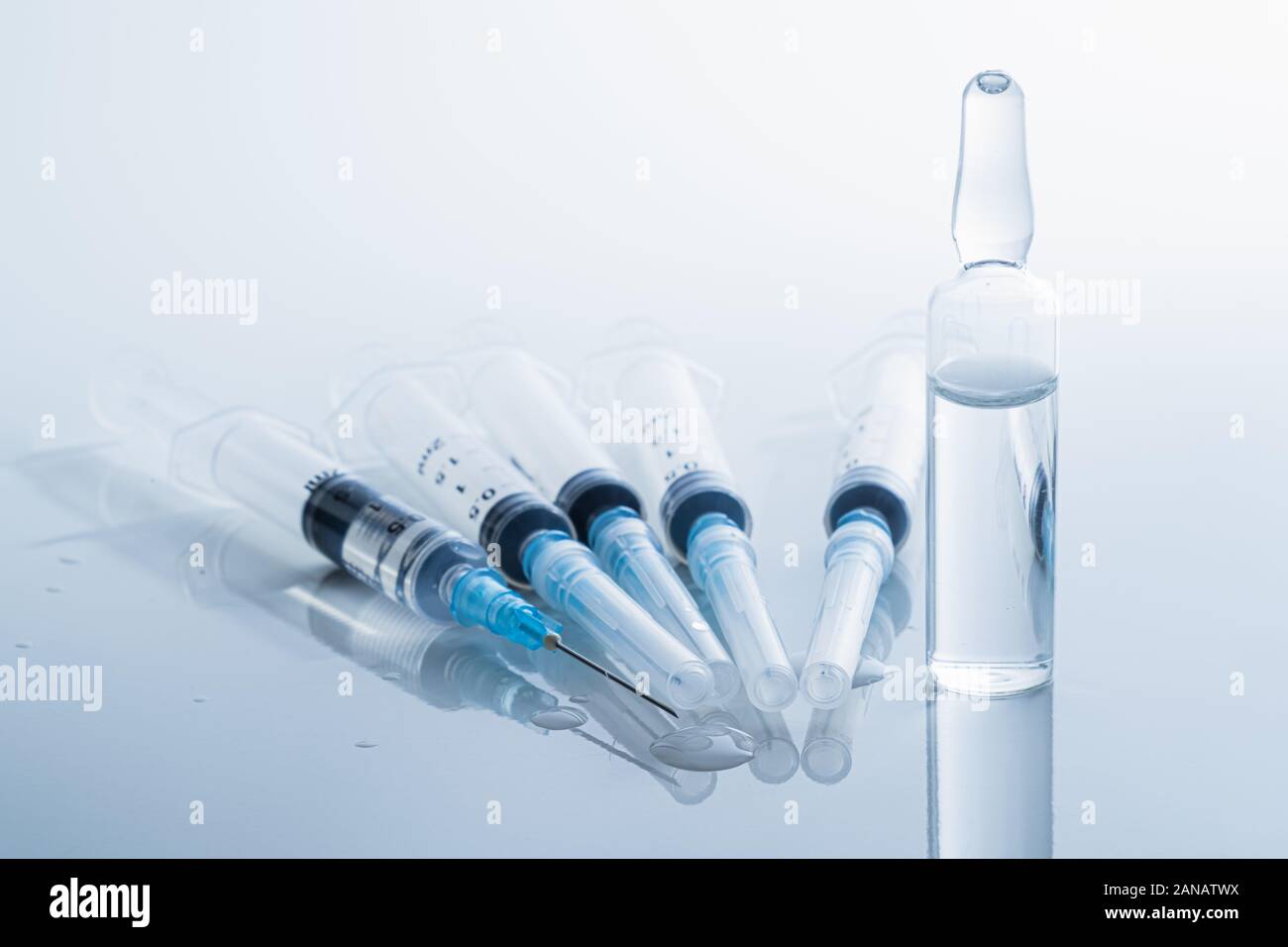 Syringes in clean medical background. Concept of injection drugs