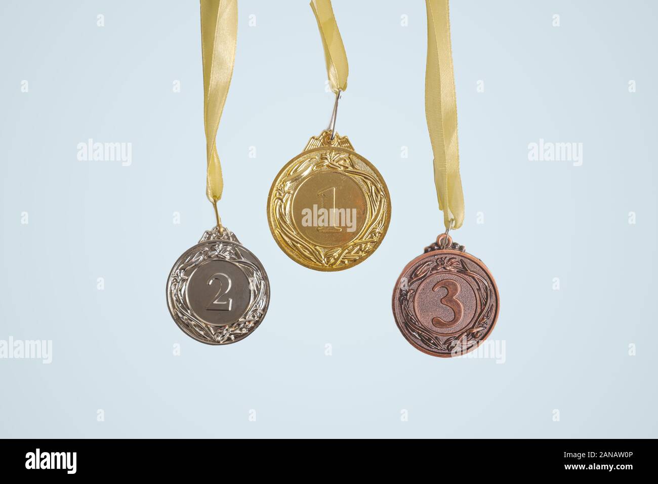 First, second and third prize medals in isolated background. Concept of sports, competition and prize winning Stock Photo