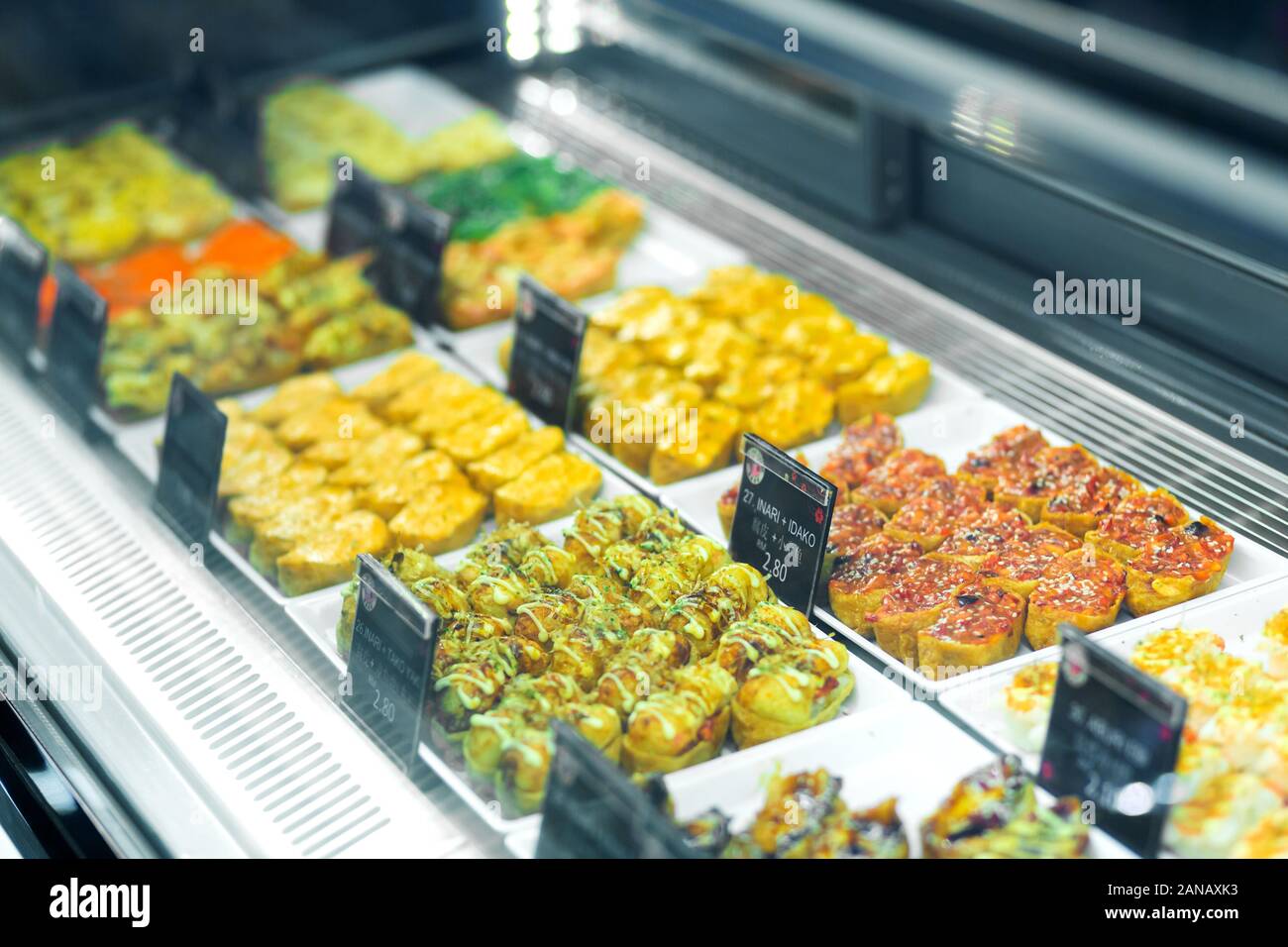 Showcases with a beautiful layout of Chinese food. Food court in the