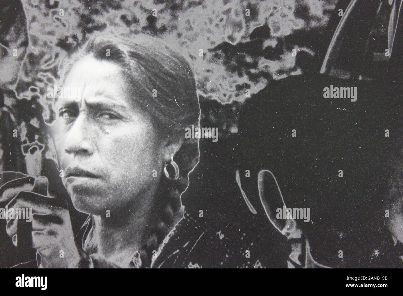 Fine seventies black and white extreme photography of a suspicious Native American woman looking at the camera Stock Photo
