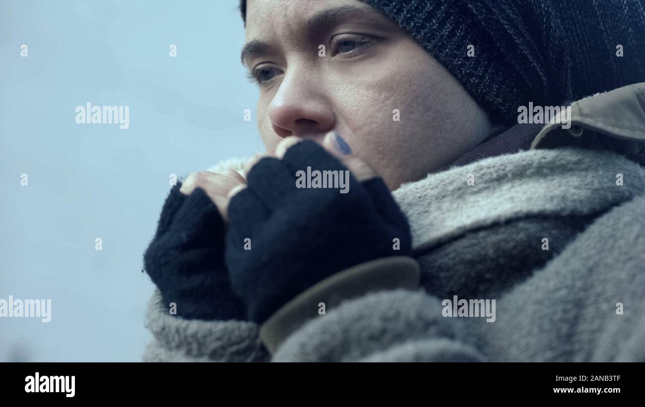 Lonely female refugee suffering cold outdoors, beggar lifestyle, helplessness Stock Photo
