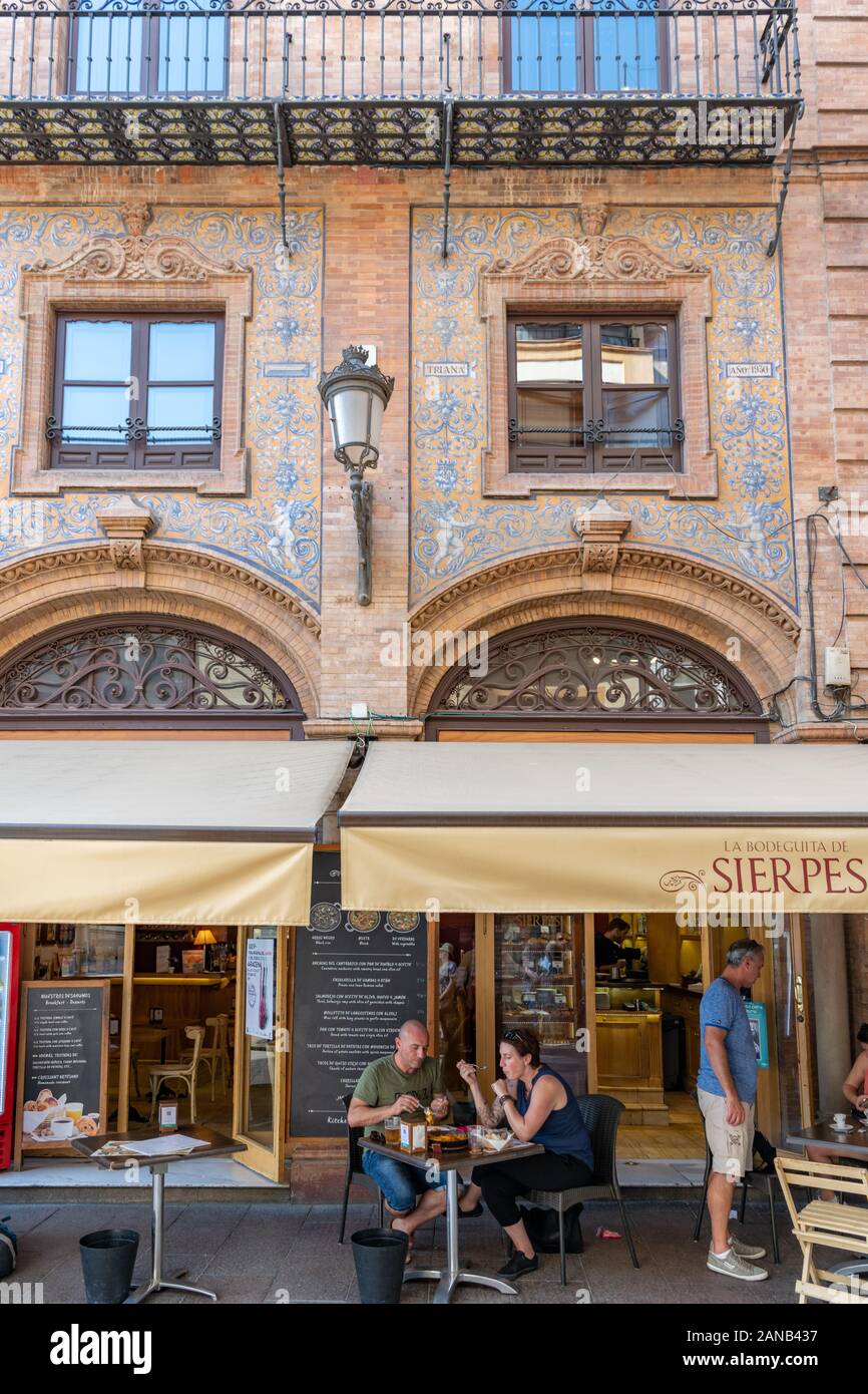 Ornate azulejos decorates the facade of La Bodeguita de Sierpes, restaurant in Calle Sierpes. Stock Photo