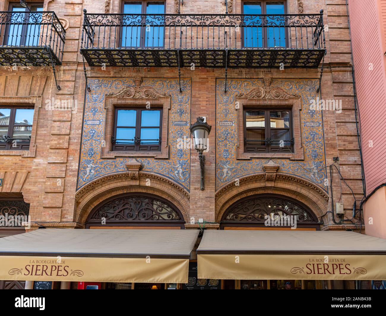 Ornate azulejos decorates the facade of La Bodeguita de Sierpes, restaurant in Calle Sierpes. Stock Photo