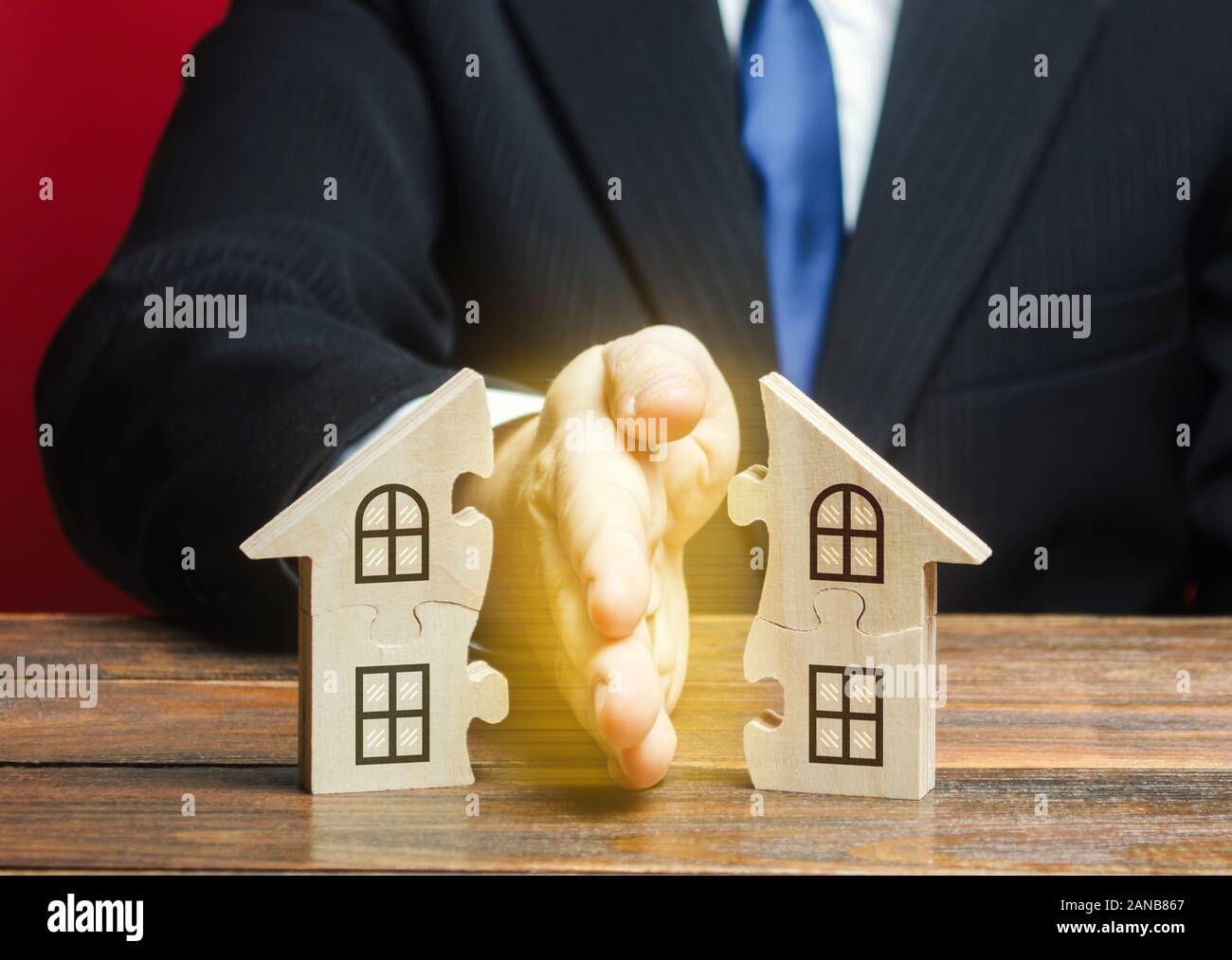 Lawyer divides the house into two equal parts in a divorce process. Protection of rights. Conflict resolution. Court, justice. Disputes over fair divi Stock Photo