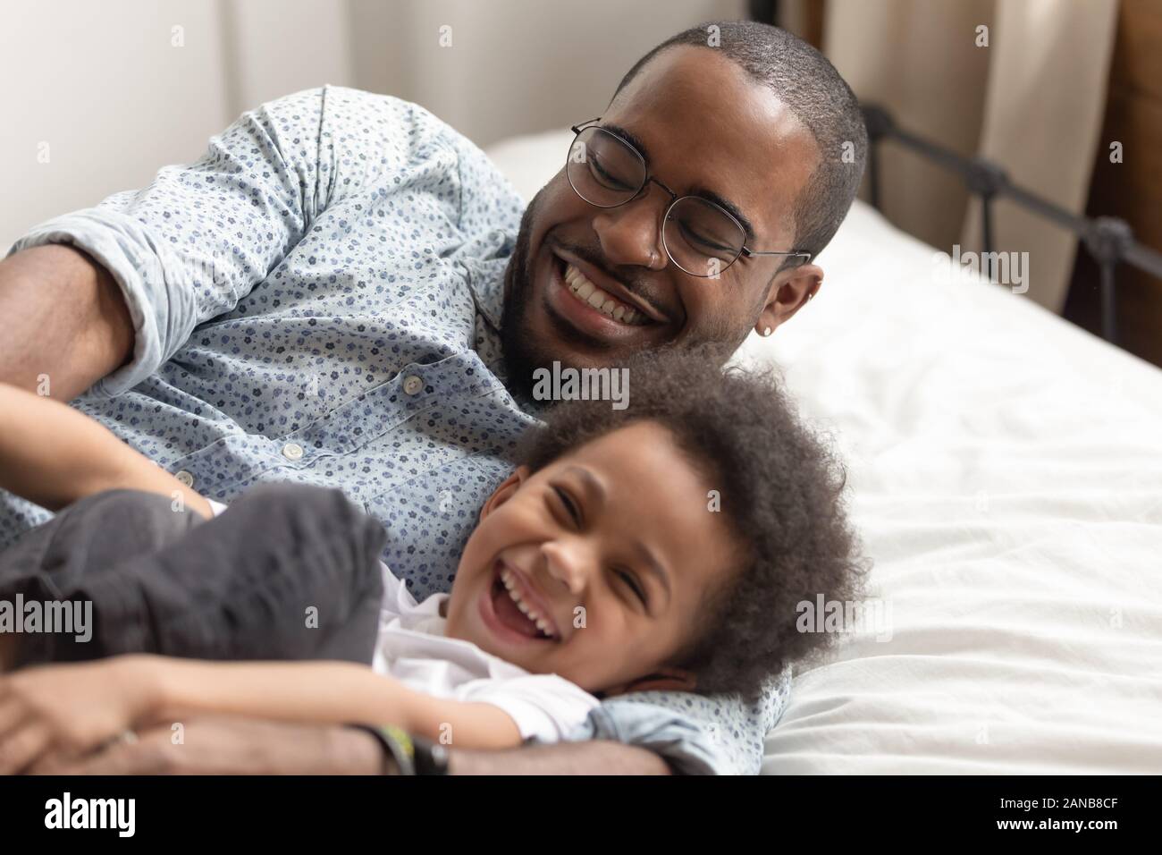 Close Up Happy Family Dad And Son Having Fun Together Stock Photo Alamy