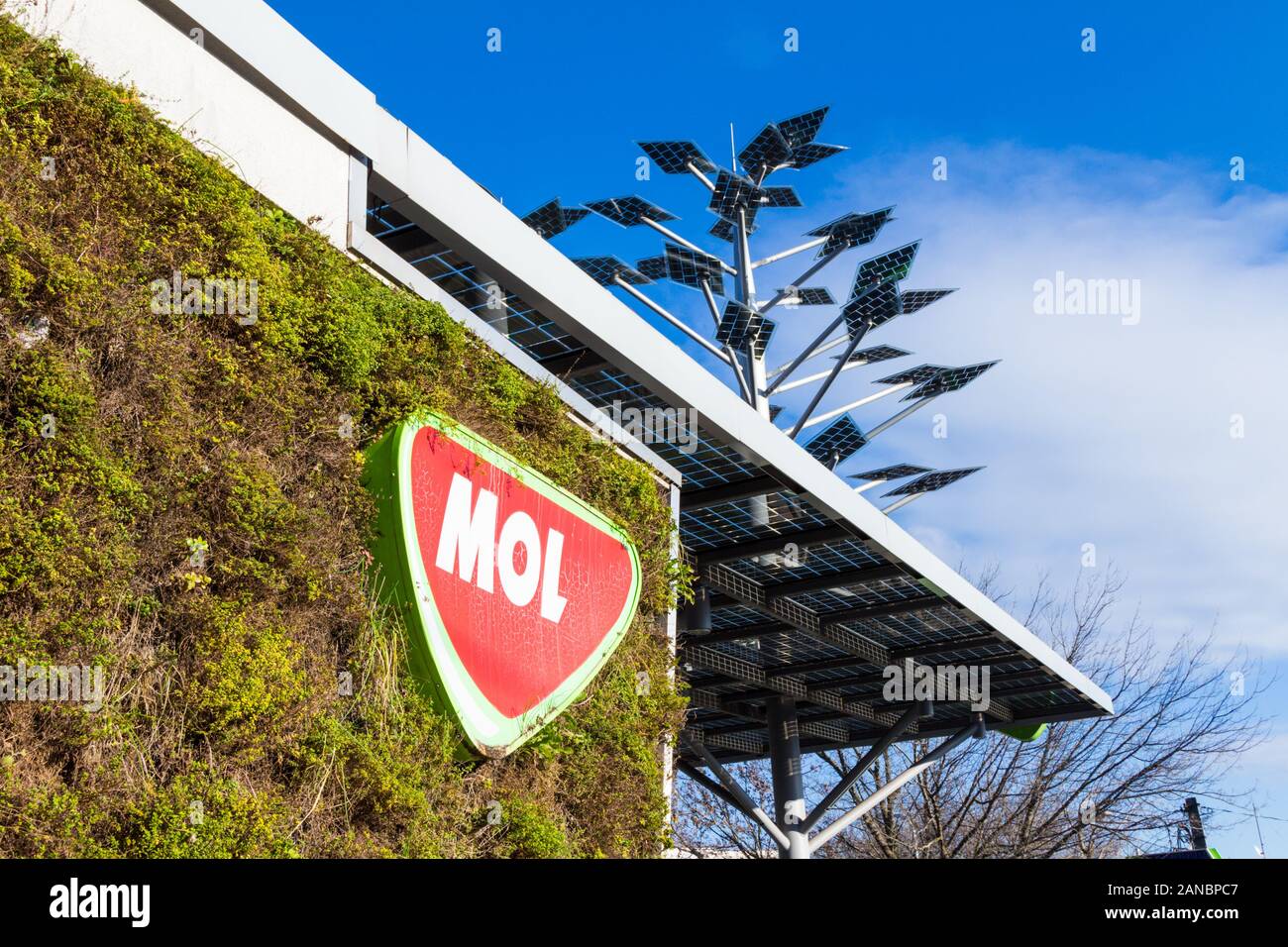 Evergreen plant covered wall and metal solar panel tree of MOL green environmentally friendly petrol station, Istenhegyi ut, Budapest, Hungary Stock Photo