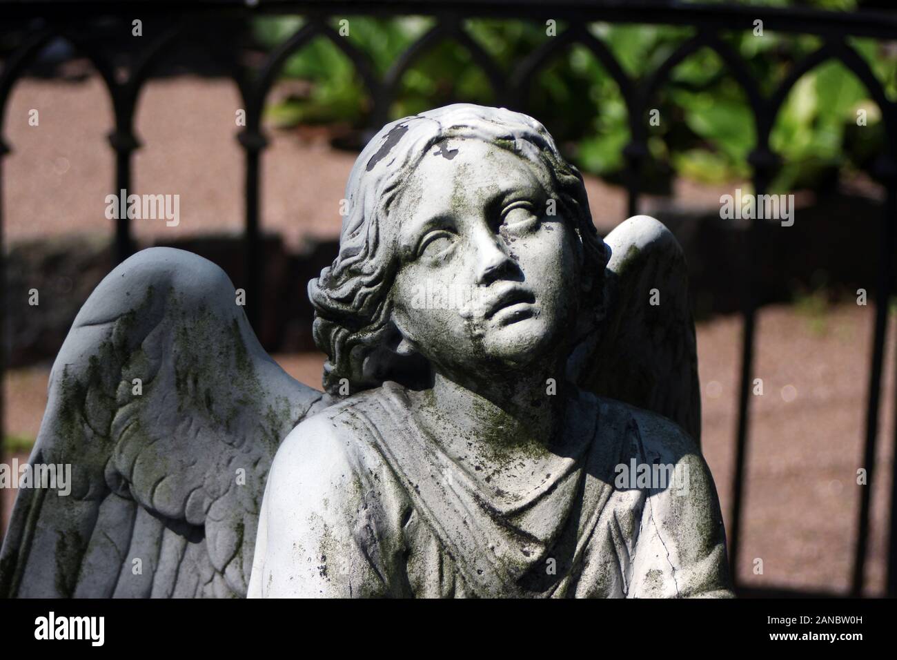 Funerary art: Angel sculpture on a grave at Hietaniemi cemetery in Helsinki, Finland Stock Photo