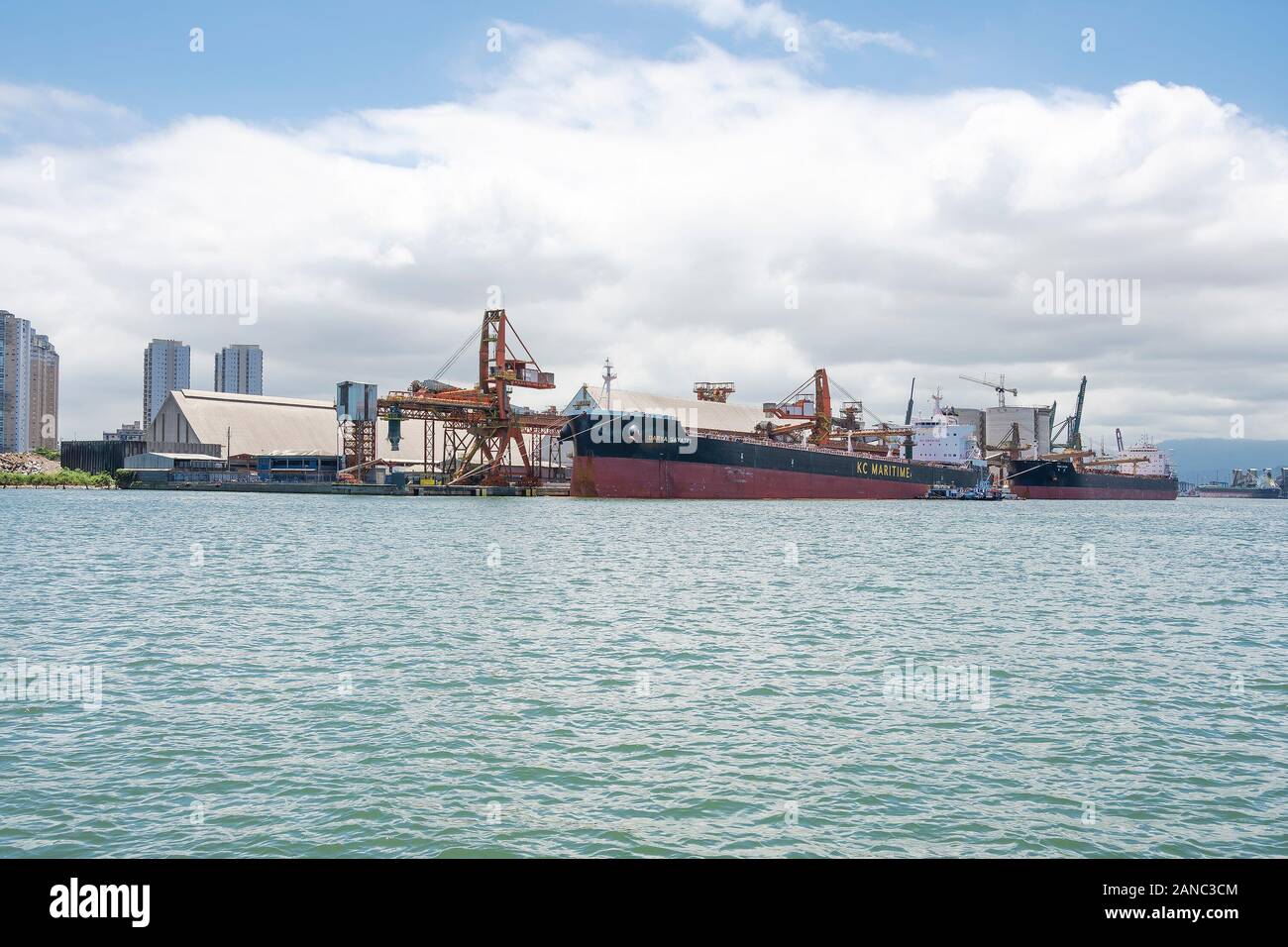 Santos - SP, Brazil - November 21, 2019: Cargo ships docked on the harbor on the coast of the city. Stock Photo