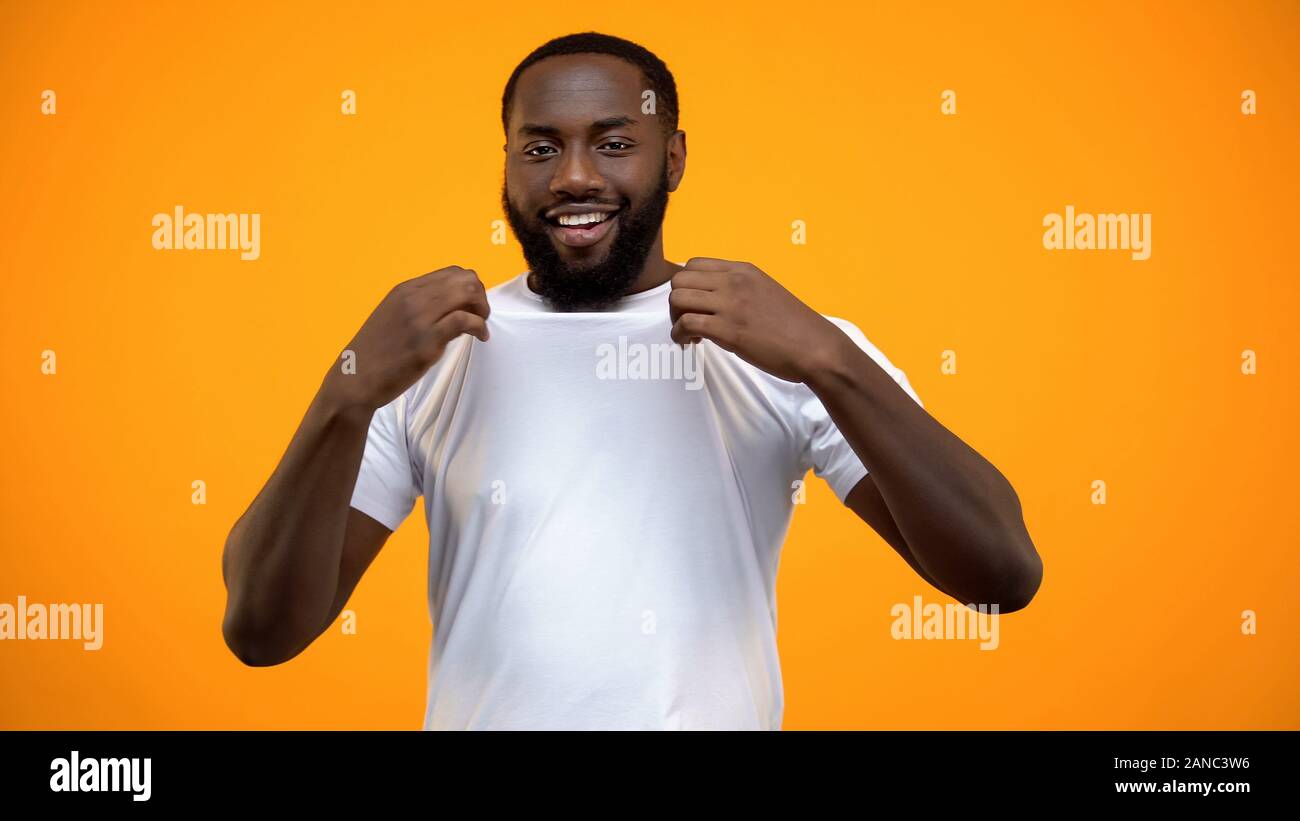 Man showing his t shirt hi-res stock photography and images - Alamy