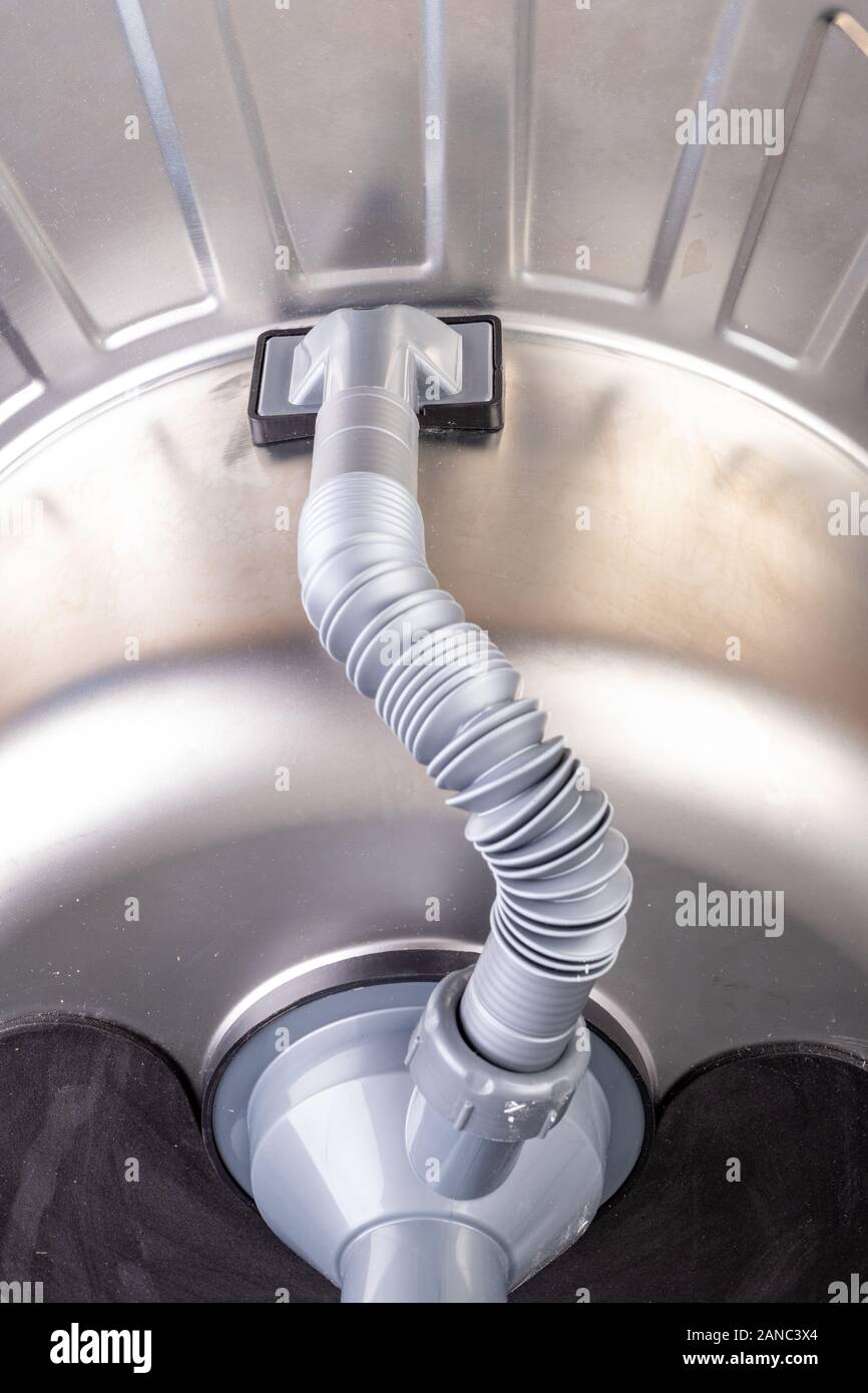 https://c8.alamy.com/comp/2ANC3X4/kitchen-sink-trap-drainage-installation-in-a-home-kitchen-dark-background-2ANC3X4.jpg
