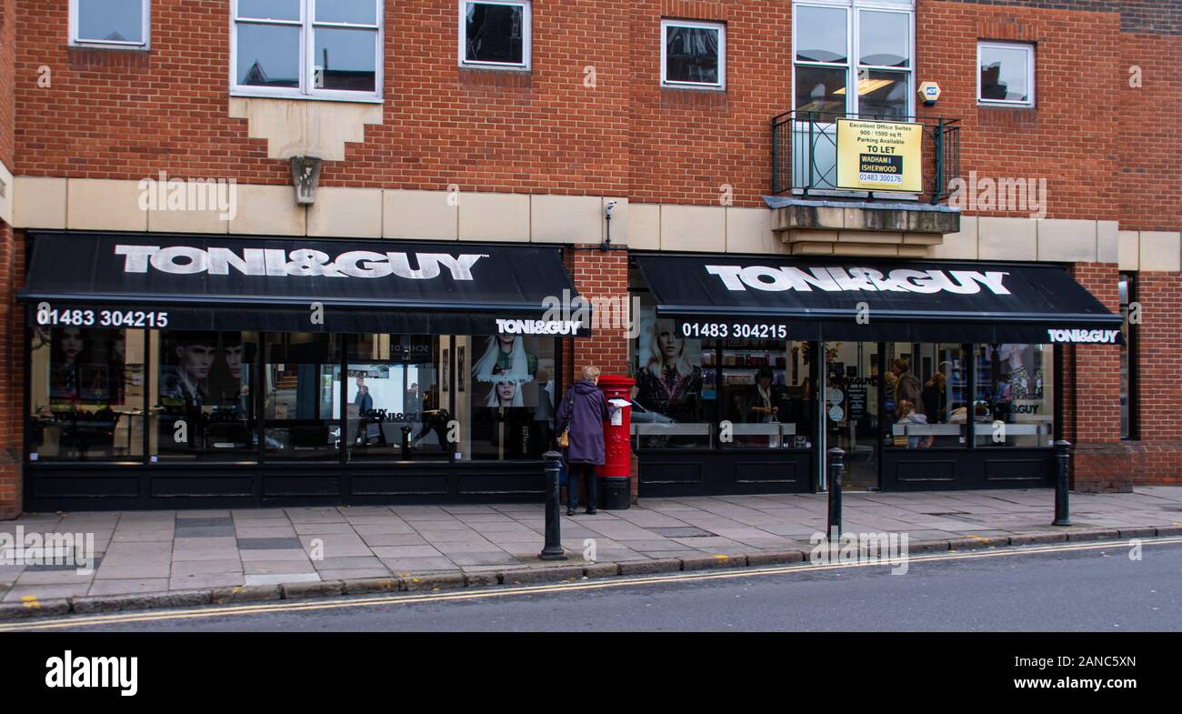 Guildford, United Kingdom - November 06 2019:  The entrance to Toni and Guy Hair salon on High Street Stock Photo