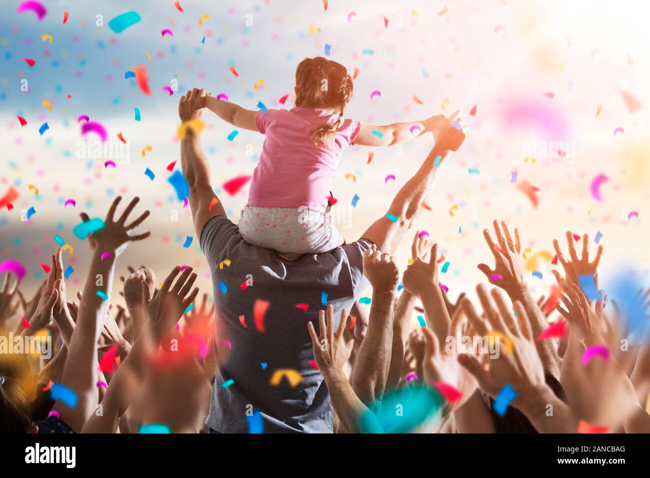 Little Girl On Dads Shoulders At Celebration Event Stock Photo