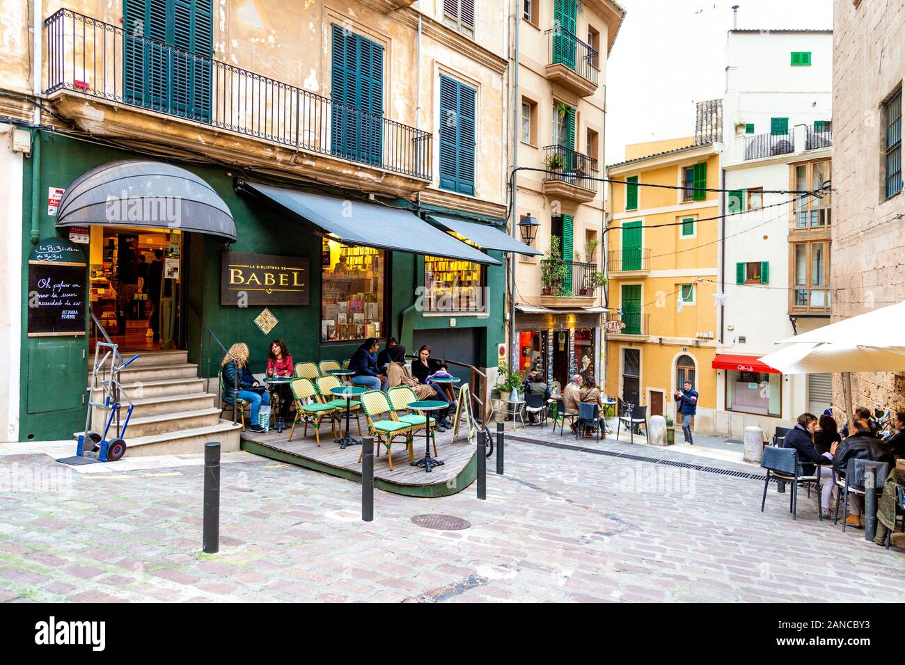 La Biblioteca de Babel and people sitting al fresco on Carrer Arabí, Palma, Mallorca, Spain Stock Photo