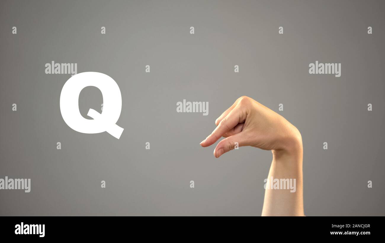 Letter Q in sign language, hand on background, communication for deaf, lesson Stock Photo