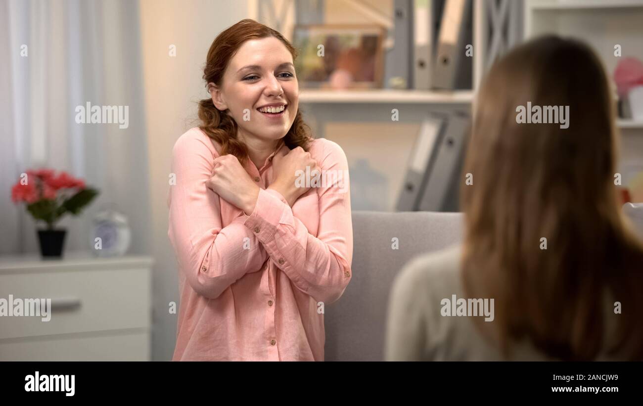 Deaf lady saying I love you asl language, friend conversation