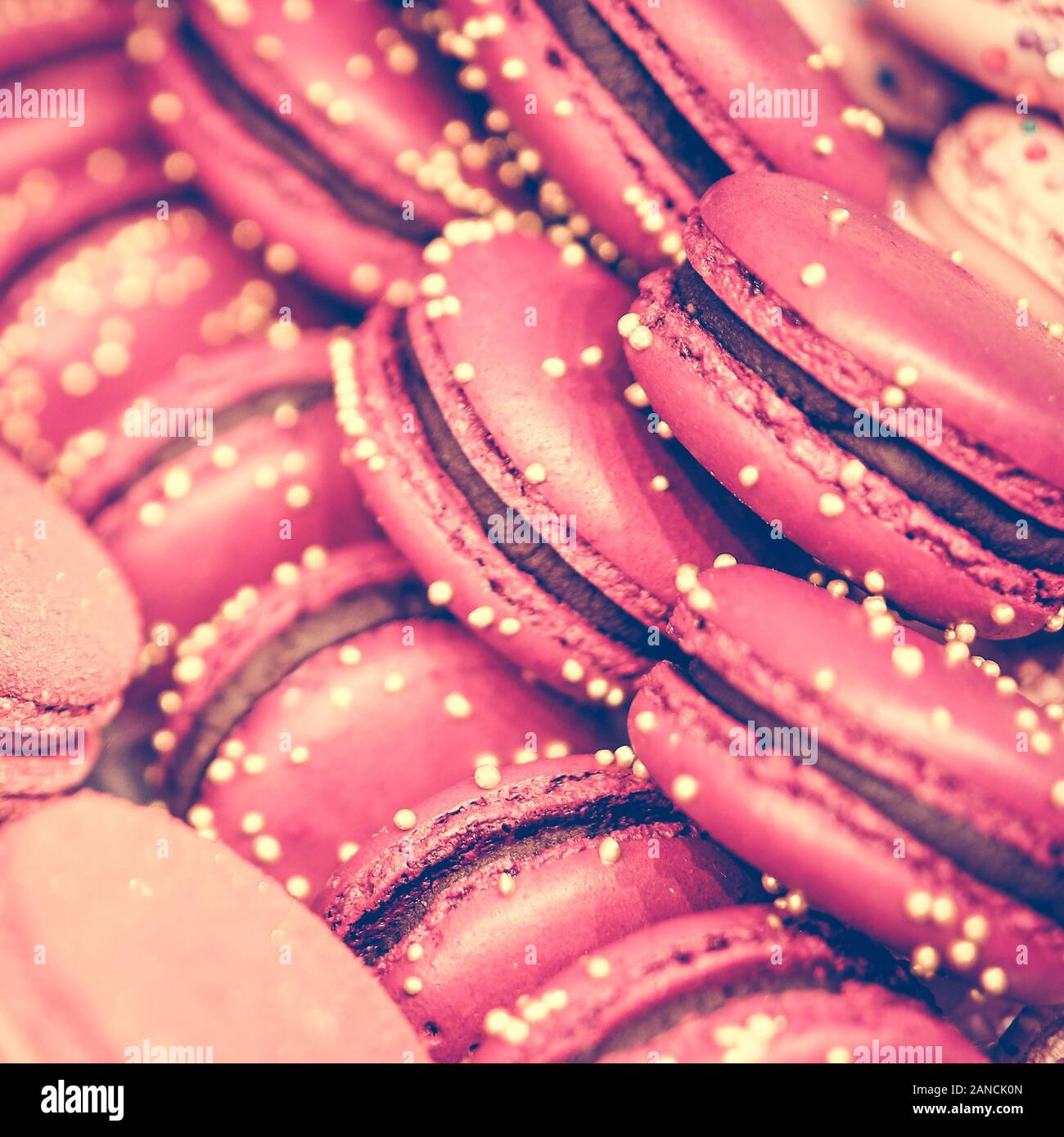 Delicious and beautiful pink macaroons on sale. Close up. square format, toned Stock Photo