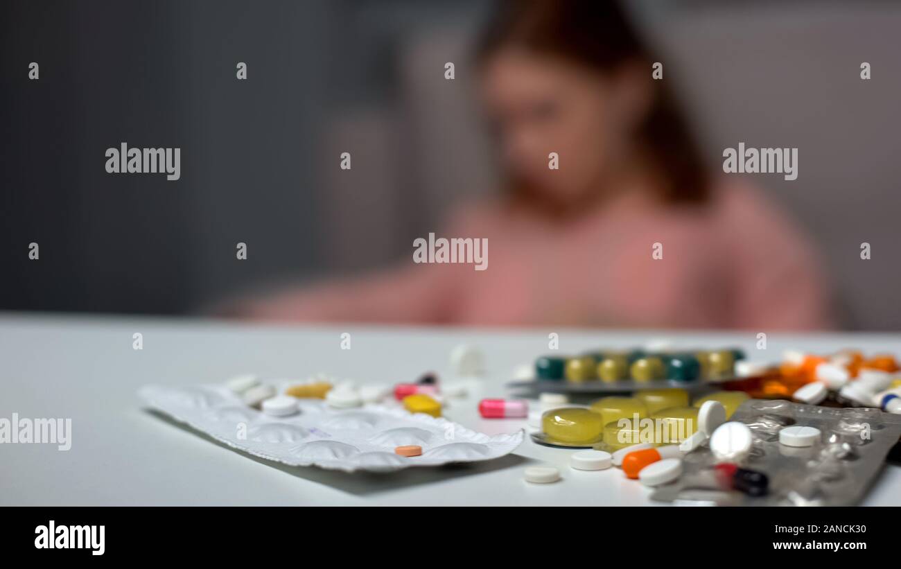 Pills and tablets on table, pharmaceutical industry, self-treatment, medicine Stock Photo