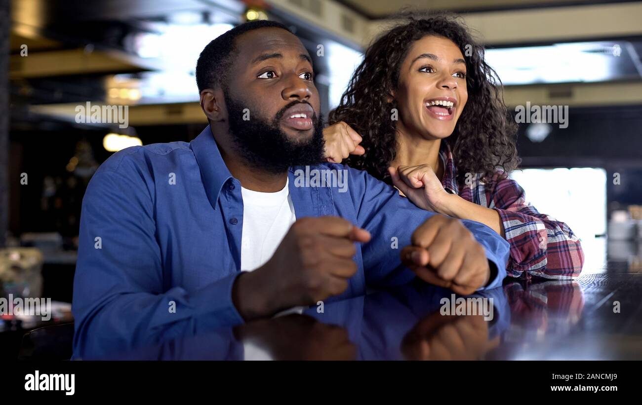 Multi racial couple rooting hi-res stock photography and images - Alamy