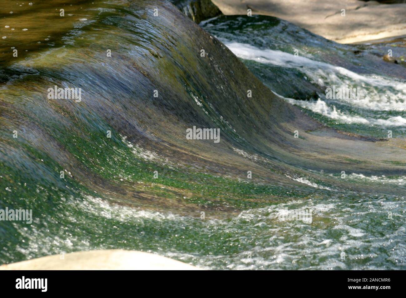 The Rocky River, in Olmsted Falls, Ohio, USA. Detail of waters flowing down smoothly. Stock Photo