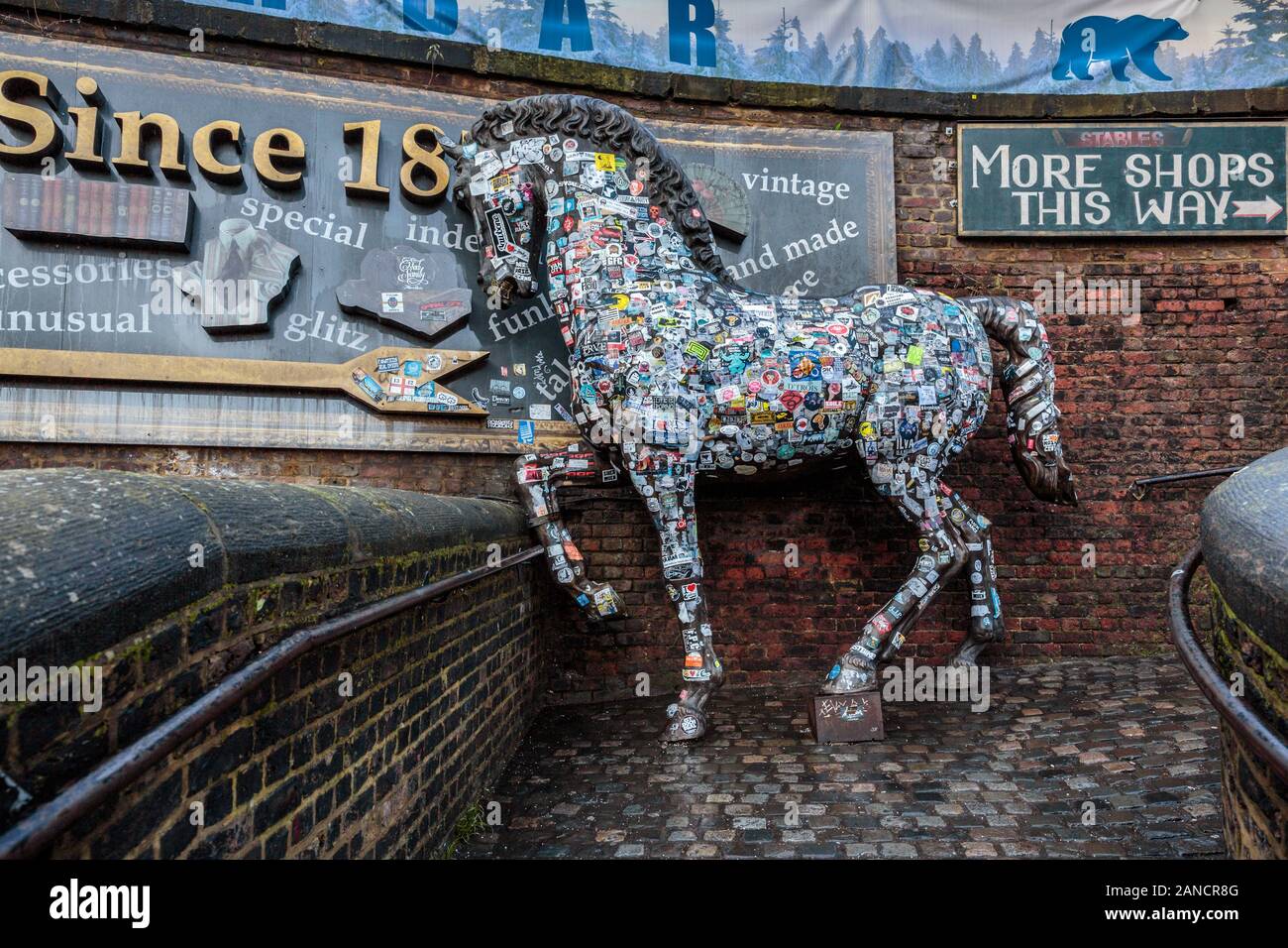 Horse statue covered in stickers, Camden Stables Market, Camden Town, London, UK Stock Photo