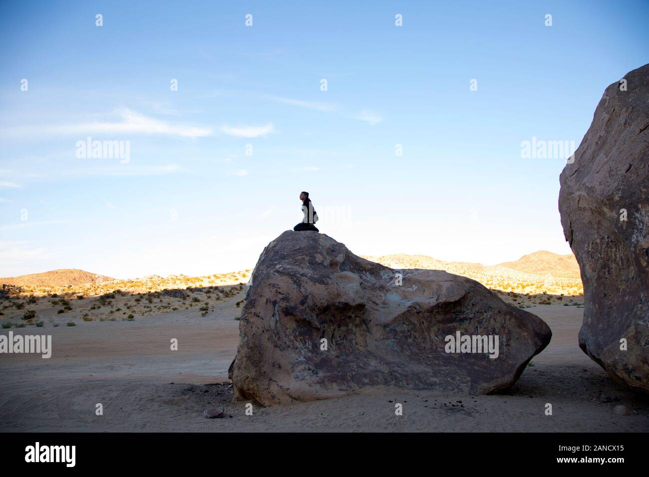 Women sitting on rock hi-res stock photography and images - Alamy