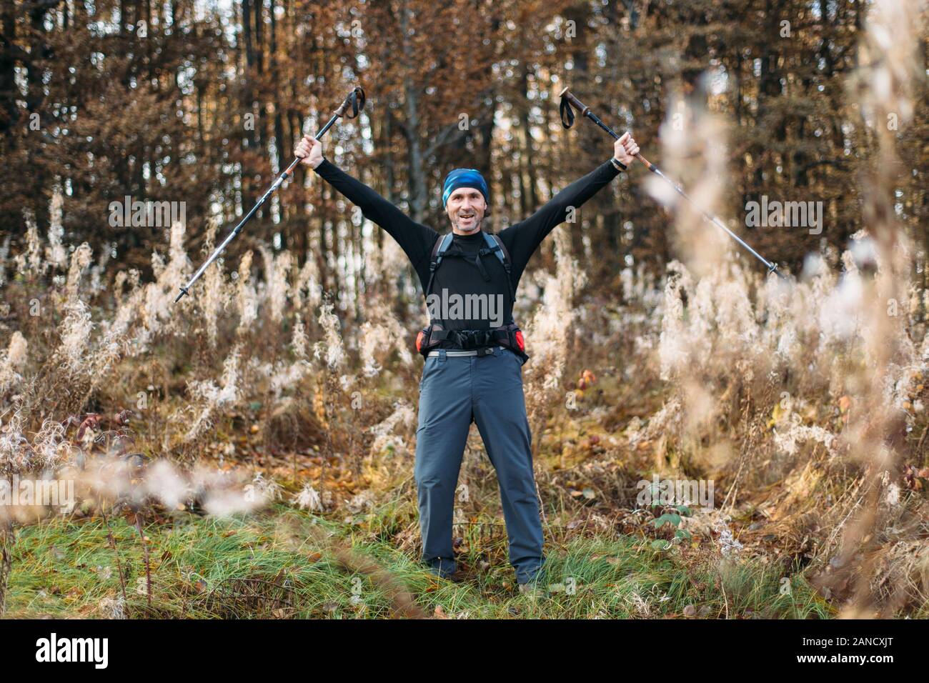 Men with trekking poles hi-res stock photography and images - Alamy