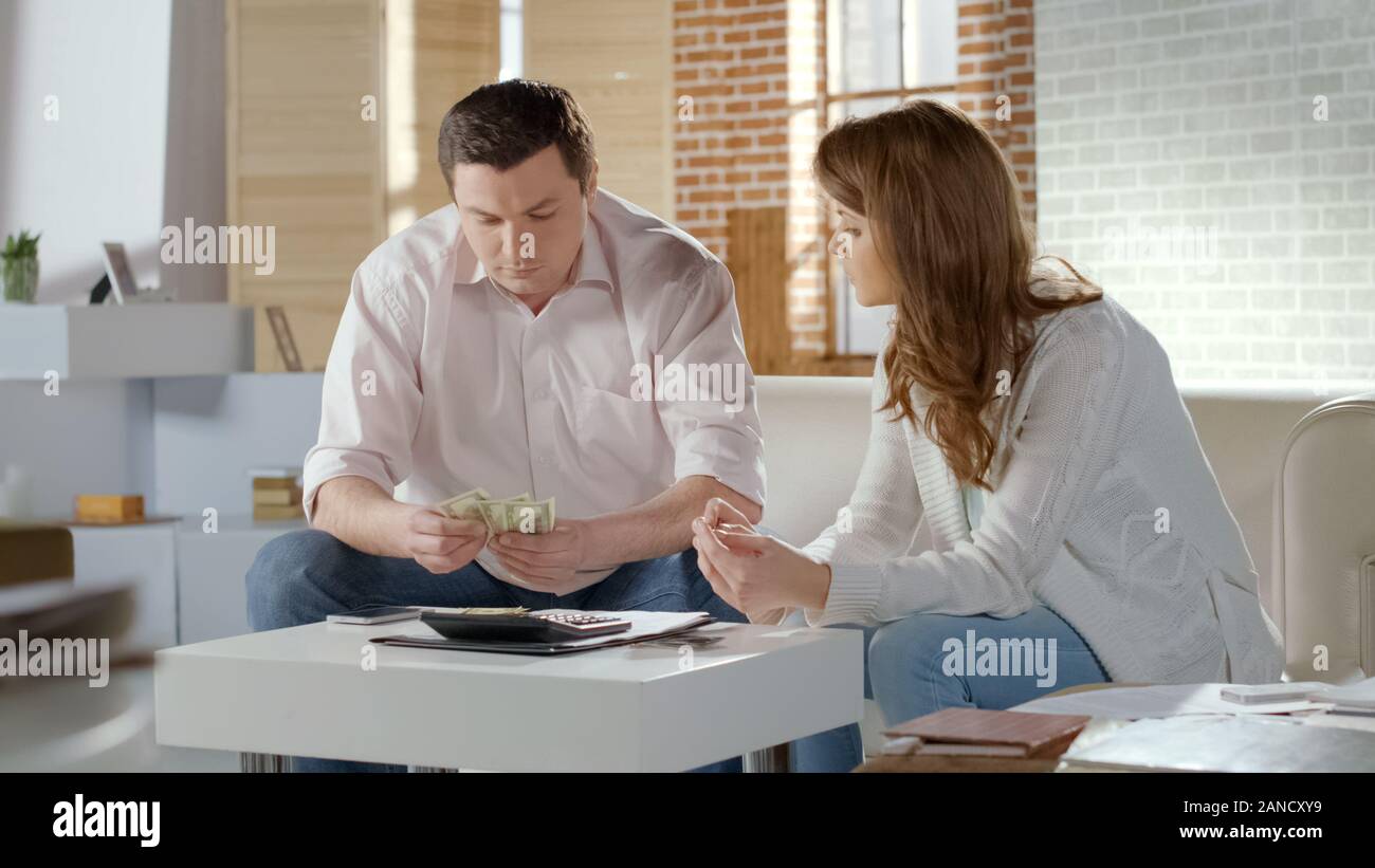 Couple calculating costs hires stock photography and images Alamy