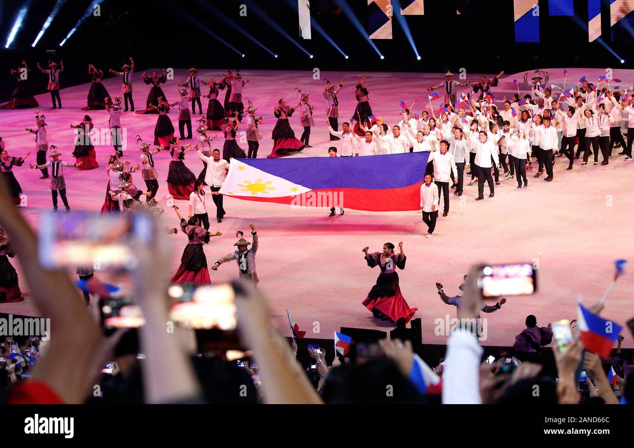 Philippines athletes and team officials march in during the opening ...