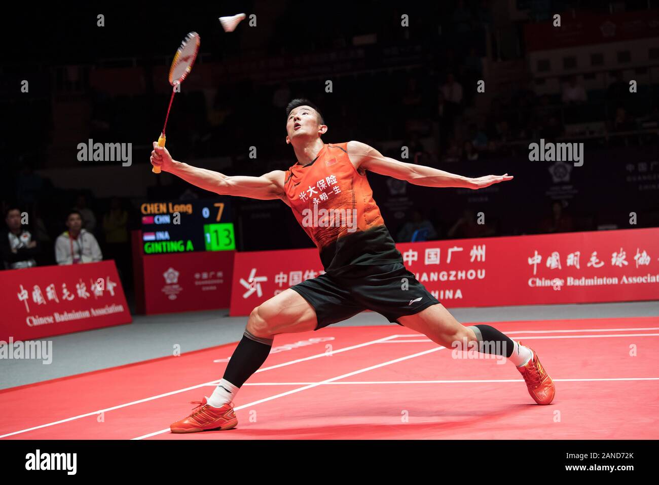 Chen Long of China competes against Anthony Sinisuka Ginting of Indonesia during group stage of mens singles of HSBC BWF World Tour Finals, Guangzhou Stock Photo