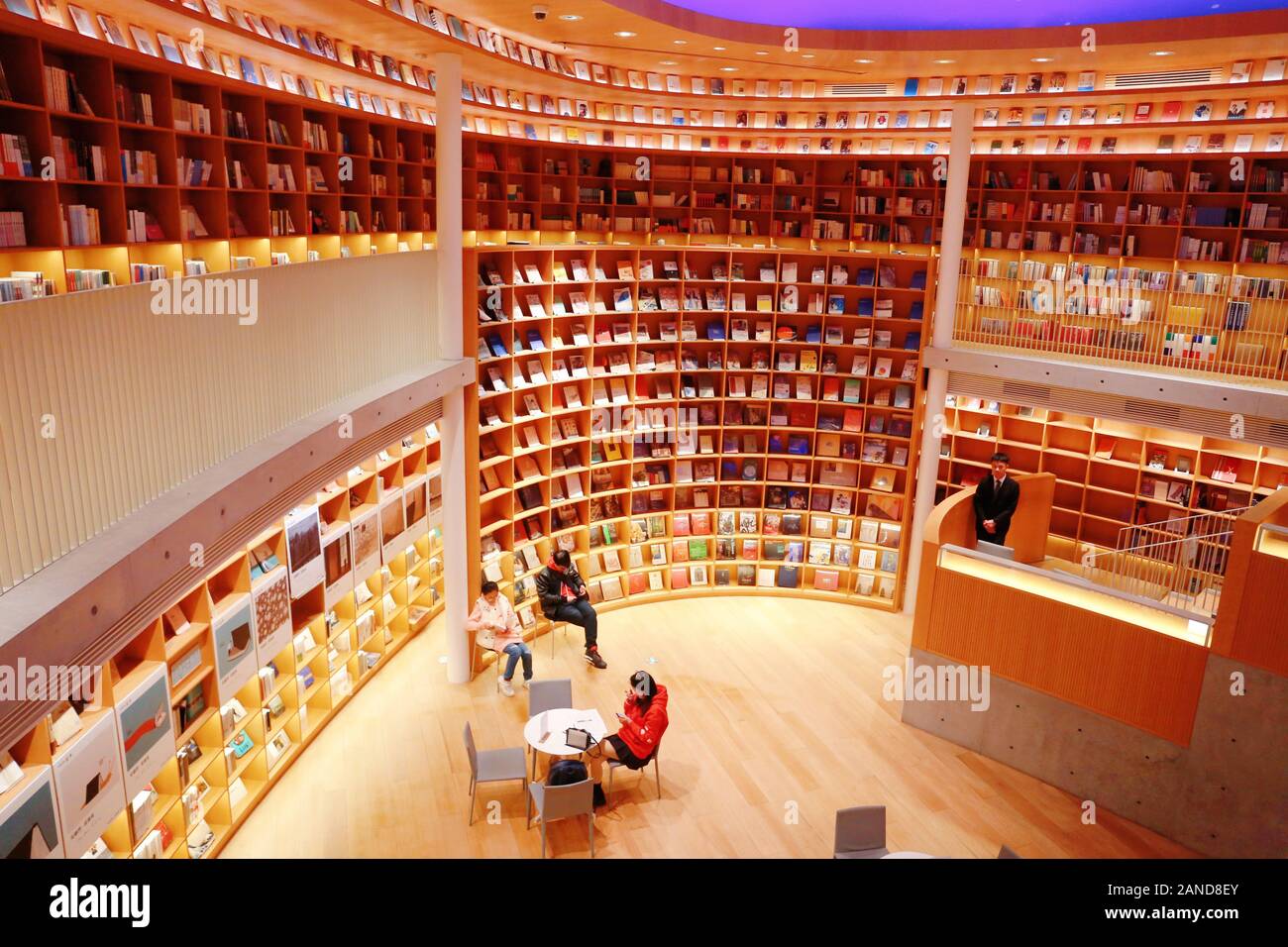 An inside view of citizens reading and strolling in the praised most beautiful Xinhua Bookstore designed by Japanese self-taught architect in Minhang Stock Photo