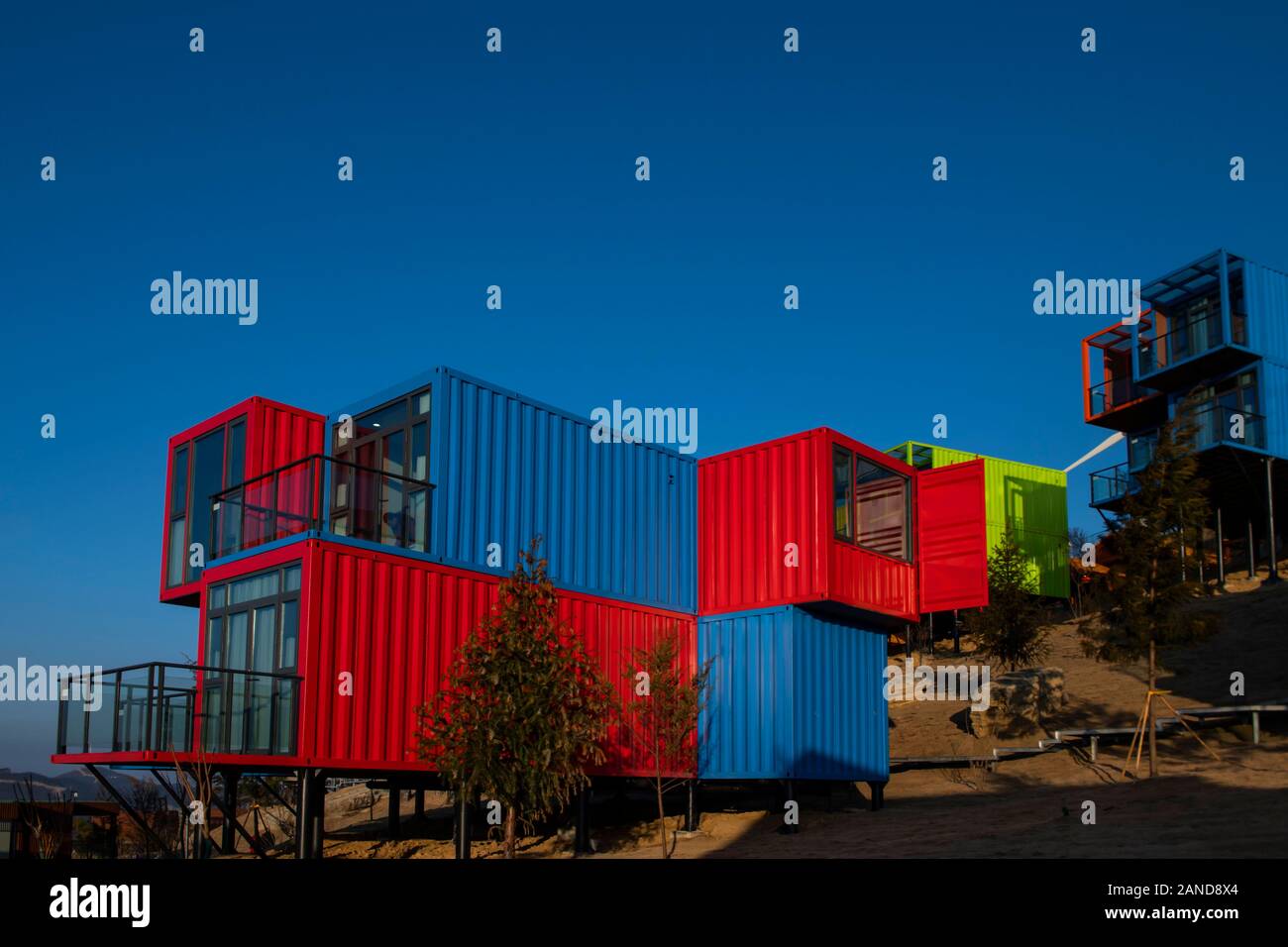 A colorful container hotel, a hotel composed of various container and ...