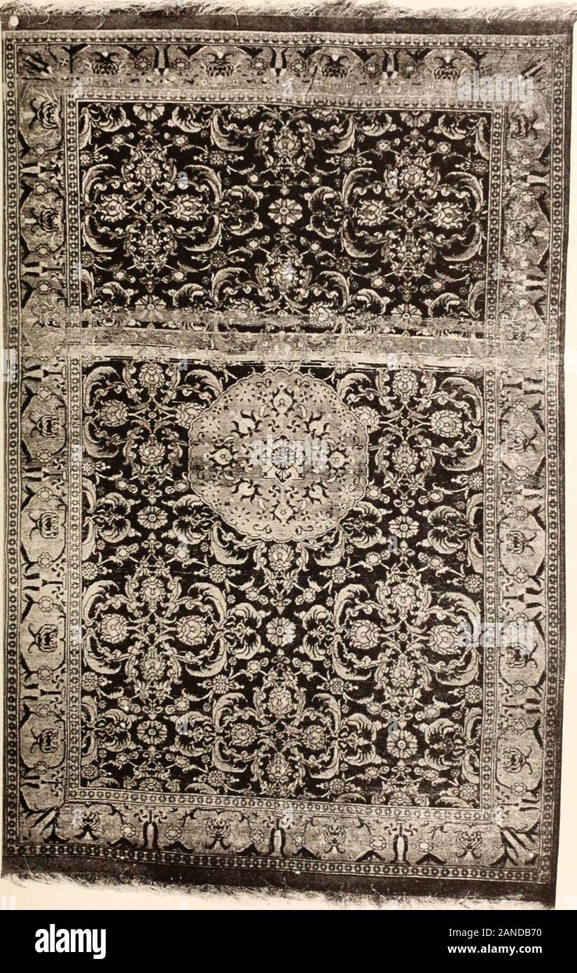 Illustrated catalogue of the exceedingly rare and valuable art treasures and antiquities formerly contained in the famous Davanzati Palace, Florence, Italy . No. OOii. Antique Oushals Palace Ru( t+, u-0 *—The Doeia Sixteenth Centuey Ispahan Caepet Rectangular shape. The field, with a blue ground, is deco-rated with an all-over patterning of palmettes and peony blos-soms, enclosed in curved pointed leaves with serrated edges andconnected by interlacements of slender steins with leaves andflowers of varied colors, the interstices occupied by oval floralmedallions with scalloped edges. The main b Stock Photo