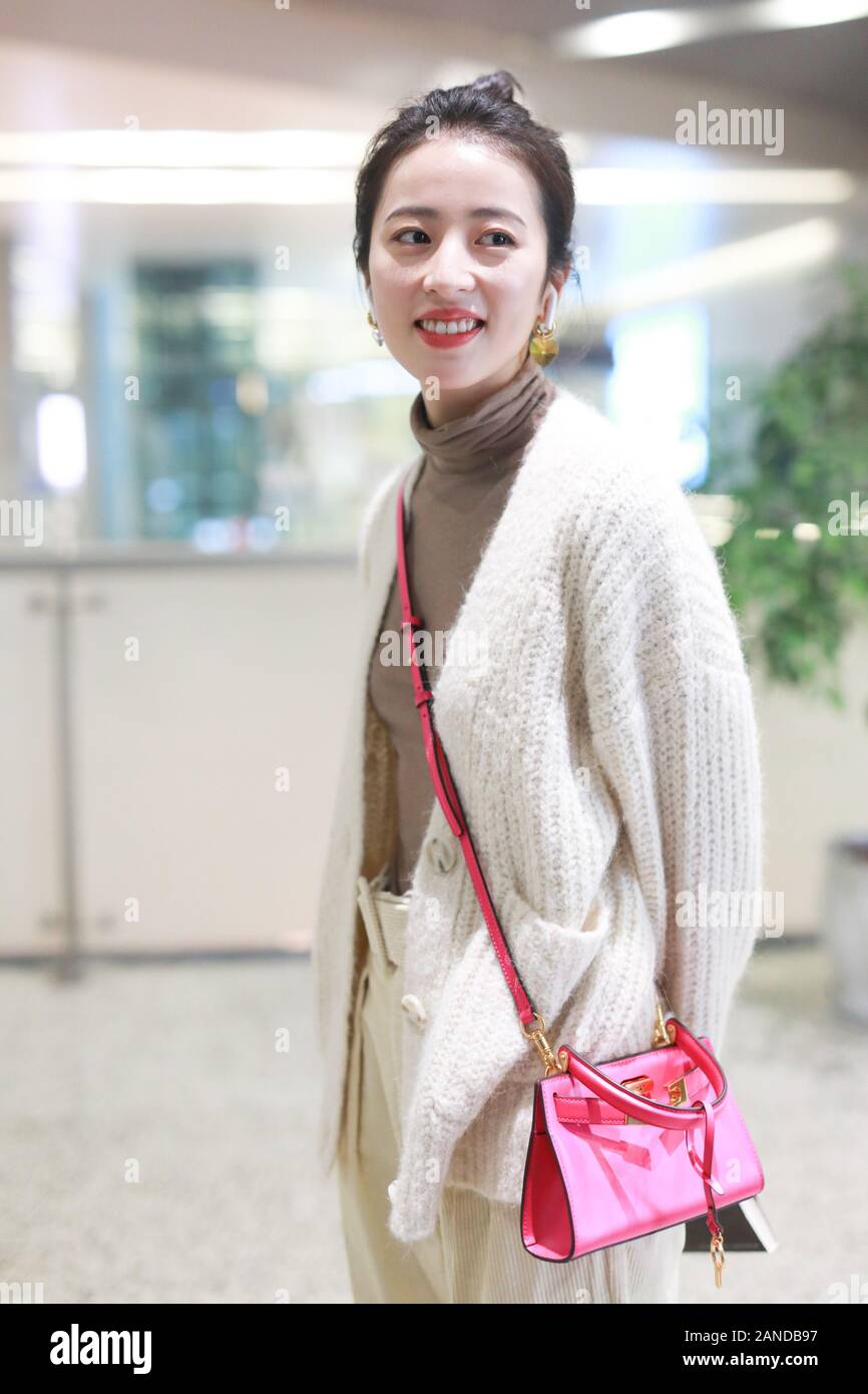 Zhou Yutong shows up at Shanghai airport before departure in Shanghai,  China, 14 December 2019. Cardigan: Mo&Co. Pants: Comme Moi Bag: Tory Burch  Stock Photo - Alamy