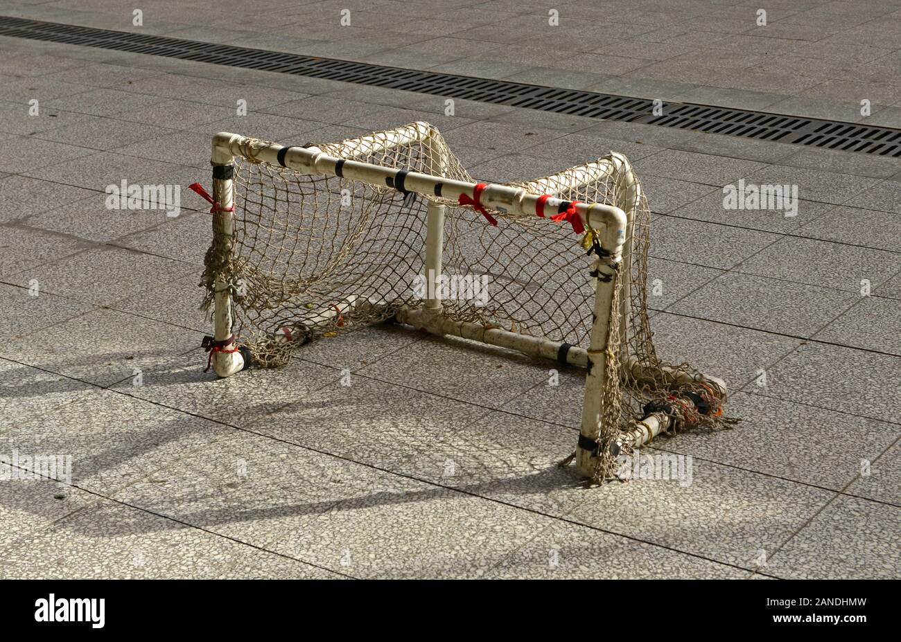 Small goals for mini-football or hockey in a pedestrianised area near Yongdingmen gate in southern Beijing, China Stock Photo