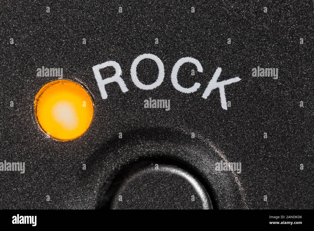 Macro close up photograph of vintage tape machine rock preset button and indicator light. Stock Photo