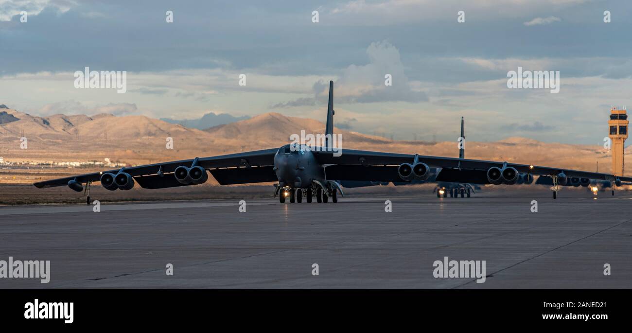 Two B-52H Stratofortress bomber aircraft assigned to the 340th Weapons Squadron at Barksdale Air Force Base, Louisiana, taxi down the flightline during a U.S. Air Force Weapons School Integration exercise at Nellis AFB, Nevada, Nov. 21, 2019. The B-52 is capable of dropping or launching the widest array of weapons in the U.S. inventory, including gravity bombs, cluster bombs, precision guided missiles and joint direct attack munitions. (U.S. Air Force photo by Airman 1st Class Dwane R. Young) Stock Photo