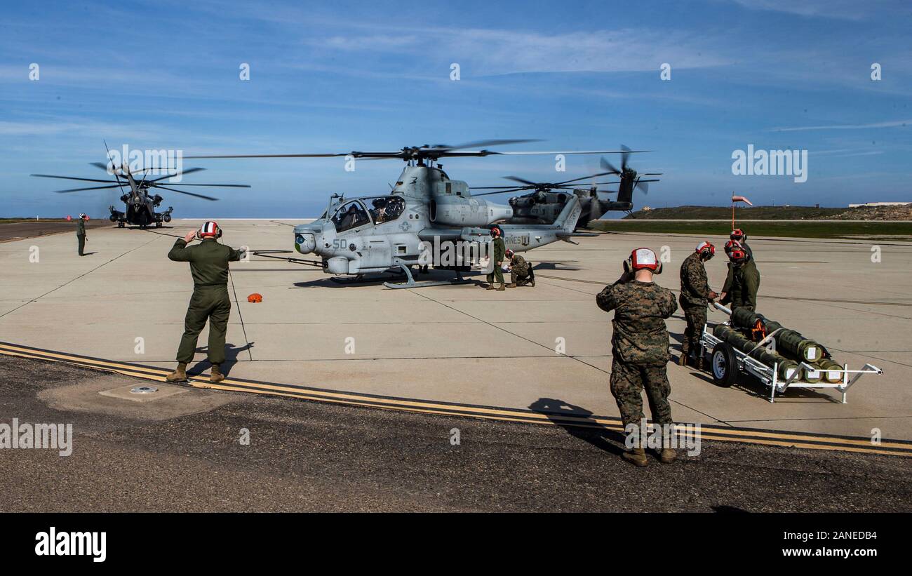 U.S. Marines with Marine Light Attack Helicopter Squadron 469, Marine Aircraft Group 39, 3rd Marine Aircraft Wing, conduct forward arming and refueling point operations during Exercise Venom Storm on San Clemente Island, Calif., Jan. 15, 2020. Exercise Venom Storm demonstrated the UH-1Y Venom’s versatility in providing lethal options, whether operating from the sea or land. It’s ability to rapidly deploy from ship-to-shore, support ground forces with its own organic fire support and be armed and refueled at temporary sites is unmatched. The Venom’s unique capabilities provide Joint-force comma Stock Photo
