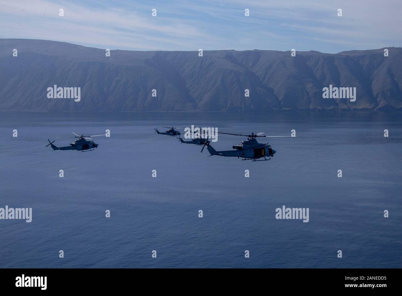 Five U.S. Marine Corps UH-1Y Venoms with Marine Light Attack Helicopter Squadron 469, Marine Aircraft Group 39, 3rd Marine Aircraft Wing, fly in to San Clemente Island to insert Marines with 2nd Battalion, 4th Marine Regiment, 1st Marine Division during Exercise Venom Storm, Jan. 15, 2020. Exercise Venom Storm demonstrated the Venom’s versatility in providing lethal options, whether operating from the sea or land. It’s ability to rapidly deploy from ship-to-shore, support ground forces with its own organic fire support and be armed and refueled at temporary sites is unmatched. The Venom’s uniq Stock Photo