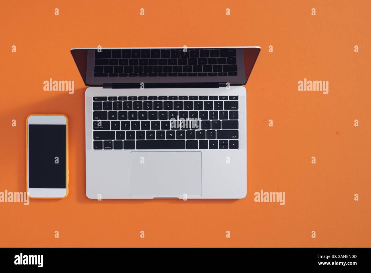 Smartphone and laptop on minimal business desk background Stock Photo ...