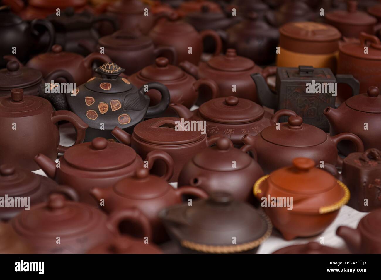 Clay Chinese teapots, a variety of species on the counter shop Stock
