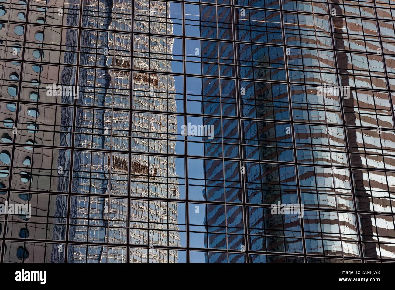 blue sky reflections in office windows in central Hong Kong Stock Photo