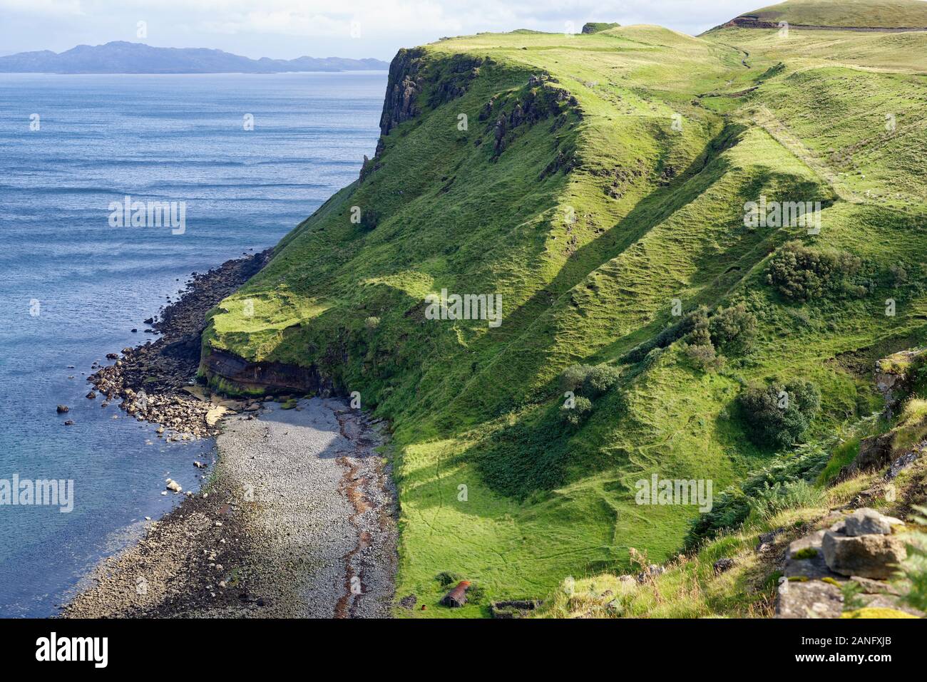Inver Tote beach with Dun Grianan Fort top right with Rona & Raasay in distance Stock Photo