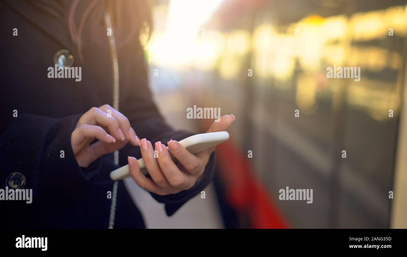 Woman checking destination point on phone, using online maps for navigation Stock Photo