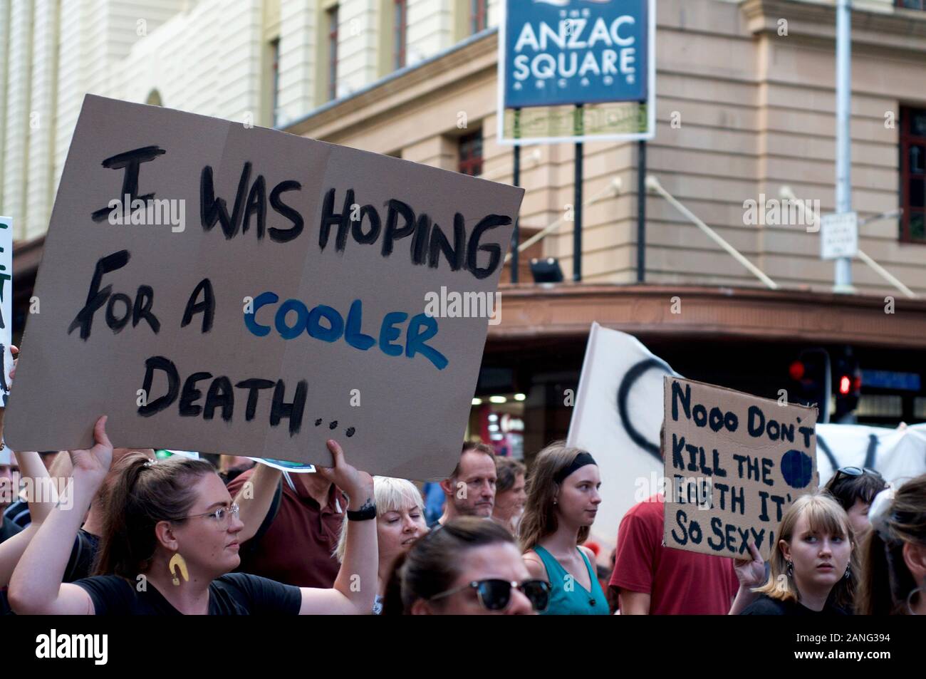 Brisbane, Queensland, Australia - 10th January 2020 : A woman holds a sign protesting government inaction during a rally for climate change action in Stock Photo