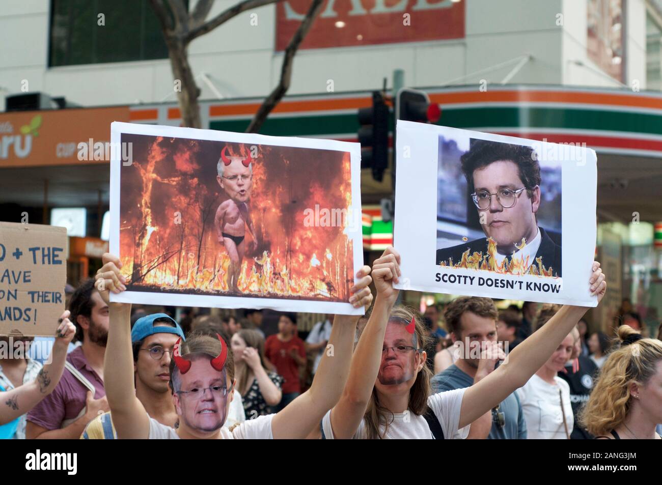 Brisbane, Queensland, Australia - 10th January 2020 : Protesters holds a sign protesting government inaction during a rally for climate change action Stock Photo