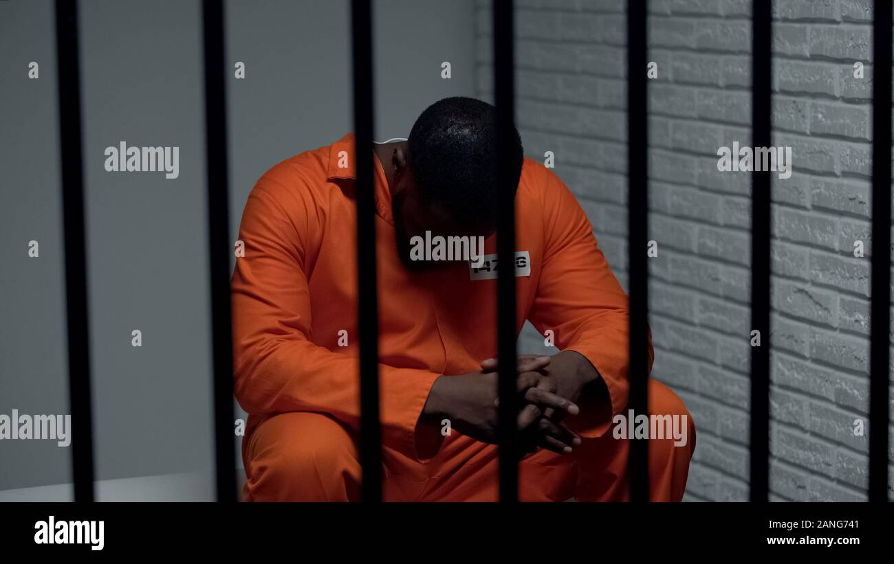 Pensive african-american prisoner waiting for visitors, serving life sentence Stock Photo