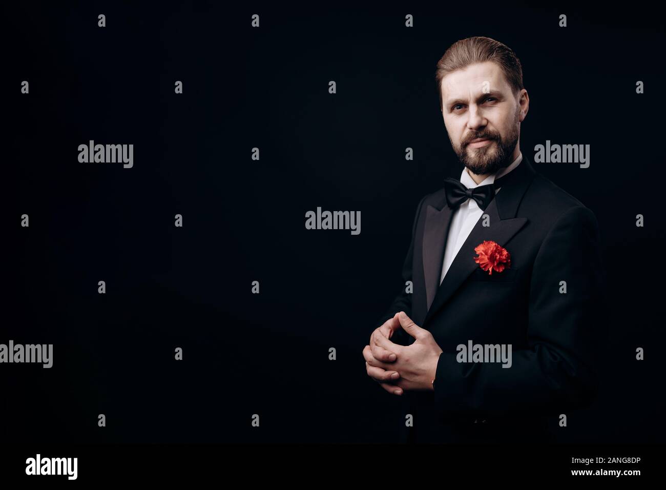 Half-turned Man in a Dinner Suit, Carnation in Buttonhole Stock Photo