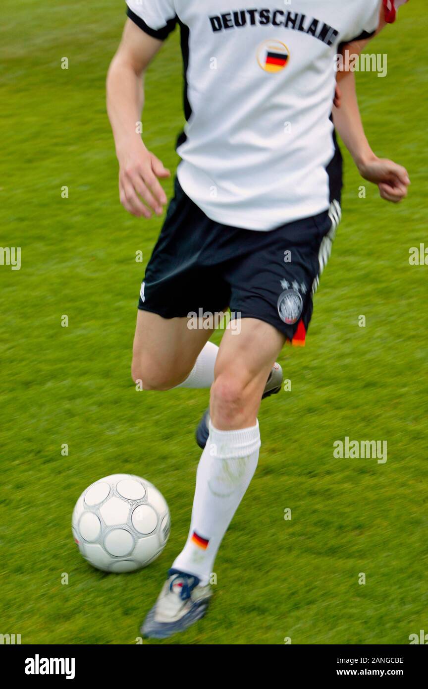 Soccer Player On The Ball Close Up Of Legs Stock Photo Alamy