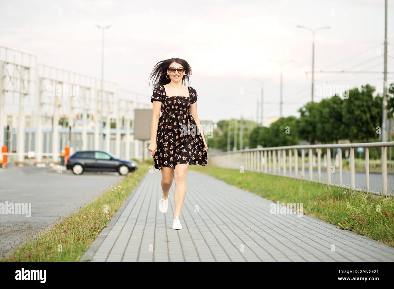 Woman running dress street hi-res stock photography and images - Alamy